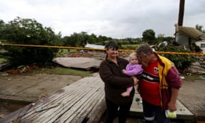 Colleen and Stephen Jones stand where their house once stood after it was swept away during flooding in Dungog in the NSW Hunter region.