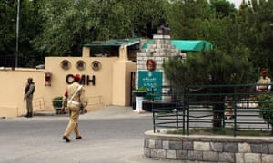 Pakistani soldiers stand guard outside a military hospital in Gilgit