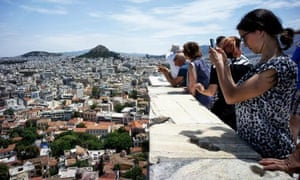 Tourists on the Acropolis Hill in Athens, Greece.
