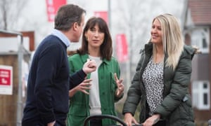 David and Samantha Cameron speak to first-time buyer Kelly Jeffers, right, in Chorley.