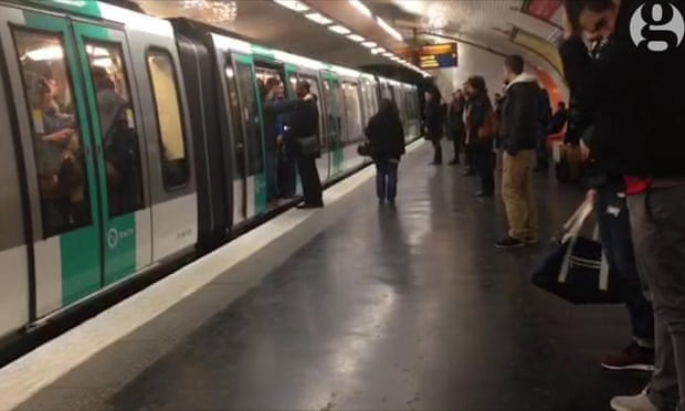 Still from the Guardian video that shows Chelsea fans preventing a black man from boarding a metro train in Paris