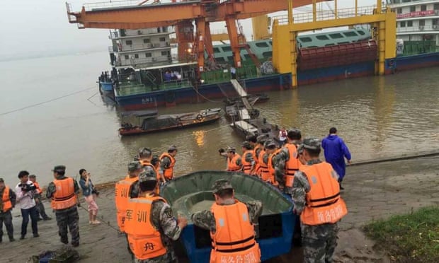 Rescue workers conduct a search in the Yangtze river after a ship carrying 458 people sank on Monday night.