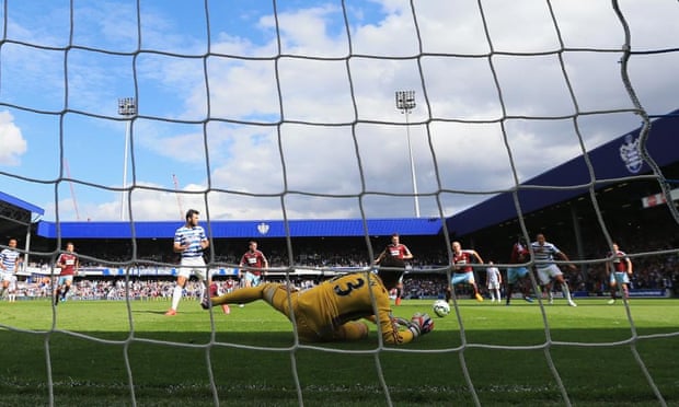 West Ham goalkeeper Adrian makes a penalty save from QPR’s Charlie Austin at Loftus Road