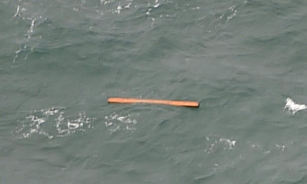 A view from an Indonesian search and rescue aircraft over the Java Sea of debris that may come from the missing AirAsia flight.