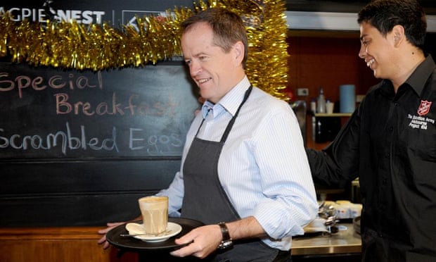 Bill Shorten chats with staff and diners as he serves up a coffee, at the Salvation Army Cafe in Melbourne last week.