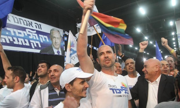 Supporters cheer at the Likud party campaign headquarters in Tel Aviv