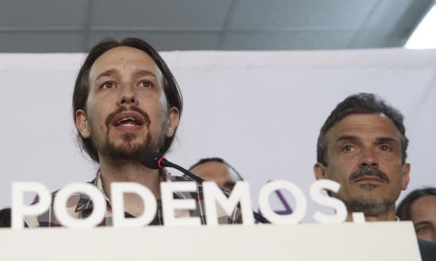 Podemos (We Can) leader Pablo Iglesias (left), speaks to supporters in Madrid.