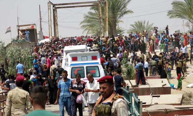 Iraqis trying to escape from Isis in Ramadi cross the Bzibz bridge, in south Fallujah, on their way to Baghdad in late May. 