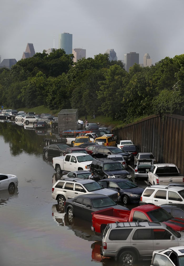 Vehicles are left stranded on a flooded Interstate 45 in Houston, Texas on 26 May.,