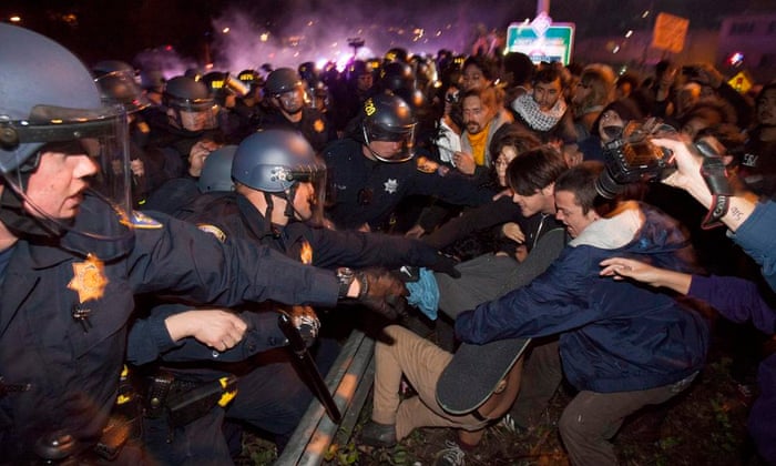 California Highway Patrol officers clash with protesters in Oakland, California