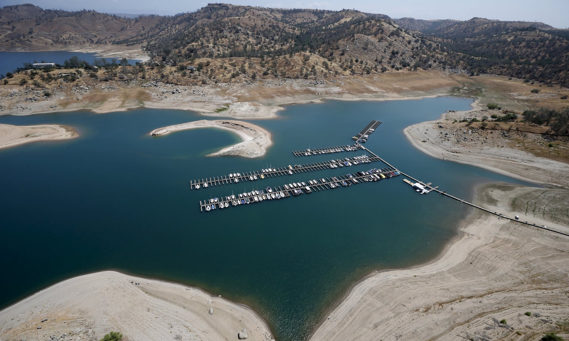 Reservoir banks that used to be underwater are seen at
