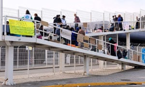 Syrian refugees block a walkway leading to the ferry terminal in Calais, France