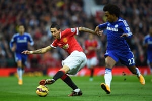 Angel Di Maria of Manchester United turns away from Willian of Chelsea.