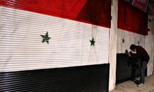 Syrian shops painted in national flag colours