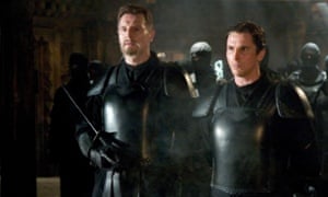Batman (Christian Bale) finds a father figure in Ducard (Liam Neeson) in Batma   n Begins.