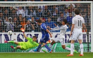 Klaas Jan Huntelaar shoots past goalkeeper Iker Casillas to score their second goal.