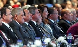 Ibrahim Mahlab, Egyptian prime minister, second from left, among delegates at the Egypt Economic Development Conference at Sharm El-Sheikh.