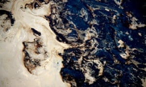 Toxic waste in a tailing pond at the Syncrude open pit oil excavation mine in Fort McMurray,Alberta, Canada, on 21 Jul 2009. The top soil is removed to give access to the controversial tar sands. The sand goes through a processing plant to extract usable oil.