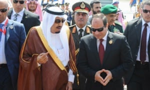 Abdel Fatah al-Sisi receives Saudi King Salman  upon his arrival ahead of the Arab Summit in Sharm el-Sheikh.