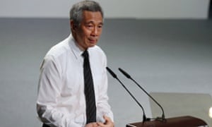 Singapore’s prime minister, Lee Hsien Loong, holds back his tears as he delivers his eulogy for his predecessor and father, Lee Kuan Yew