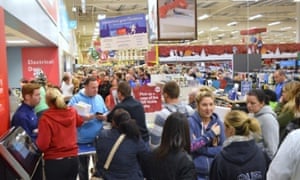 Shoppers queue at at a Tesco store in Lurgan, County Armagh, on Black Friday.