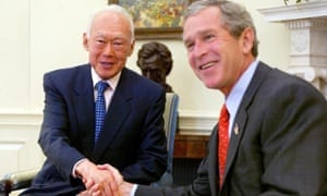 This file photo taken on May 1, 2002 shows US President George W. Bush welcoming Singapore's Senior Minister Lee Kuan Yew (L) to the Oval Office for a meeting at the White House in Washington, DC