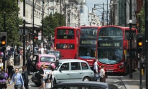 Buses and taxis fill Oxford Street.