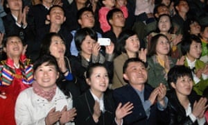 North Koreans watching fireworks during celebrations to mark the 103rd birth anniversary of late president Kim Il-sung at Mansu Hill in Pyongyang.