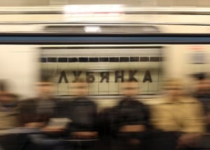 A sign that reads "Lubyanka" is seen through a window of a moving train at Lubyanka metro station in Moscow March 30, 2010. Moscow observed an official day of mourning on Tuesday and nervous commuters returned to the metro, while the death toll from twin suicide bombings on the capital's underground railway rose by one to 39 people.