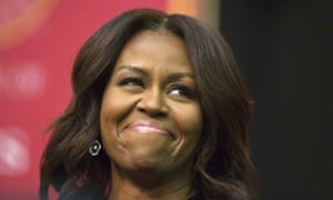 Michelle Obama smiles before she speaks during the Tuskegee University's spring commencement.