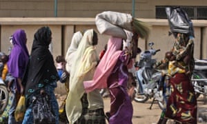 Women walking in Nigeria, where it is estimated that a quarter of girls and woman between 15 and 49 from all religious communities have undergone female genital mutilation (FGM). 