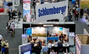 (Schlumberger) Attendees visit exhibit booths at the DUG Eagle Ford Conference & Exhibition in San Antonio, Texas, U.S., on Monday, Oct. 15, 2012. 