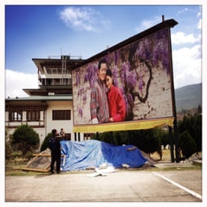 A large billboard of Bhutan’s king and queen
