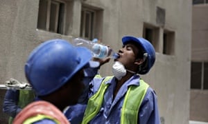 A Nepalese worker takes a break during a government-organised media tour of World Cup construction p