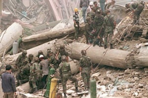 US military troops and South Korean army soldiers look for survivors in the rubble. 502 people died, and almost 1,000 were injured in the collapse.