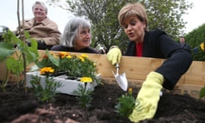 Nicola Sturgeon (right) visiting a gardening project at a housing association development in Craigmillar, Edinburgh.