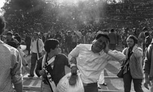 Supporters flee the scene of riots in Heysel football stadium in Brussels.