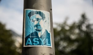 A Berlin poster campaigns to grant asylum to whistleblower Edward Snowden, who revealed the extent of US and UK government surveillance