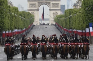 Horsemen from the French republican guard parade on the Champs-Elysees in Paris