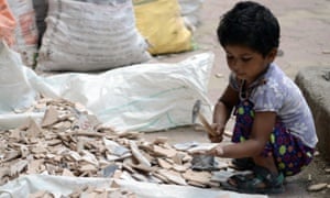 An Indian child breaks tiles in Mumbai, June 2015. India’s government recently toughened child labour laws, but activists say the steps are inadequate. 