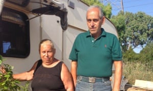 Georgios Karvouniaris and his sister Barbara outside their donated caravan, without which they would be homeless