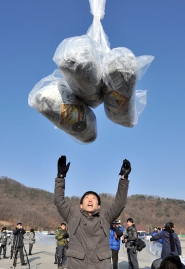 Dissenting voice ... Park Sang-hak, releasing a balloon carrying anti-North Korea leaflets, has been branded 'human scum' by the regime. Photograph: Jung Yeon-je/AFP/Getty Images