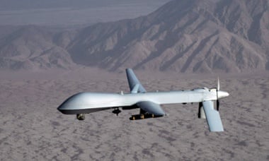 A US MQ-1 Predator unmanned aircraft in flight at an undisclosed location.