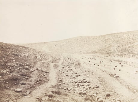 The Valley of the Shadow of Death, 1854.<br><br>During the Crimean war, Roger Fenton took two photographs of a ravine within range of the Russian fortifications at Sevastopol that was subject to intensive cannon-fire. Some scholars claim Fenton added the cannon balls in this photograph to increase the sense of danger. In the other photograph, the cannon balls are no longer on the track. Scholars suggest either that the road was cleared to allow for the passage of Fenton’s mule-drawn dark room, or that the cannon balls were ‘recycled’ by nearby British soldiers to fire back at the Russian enemy.