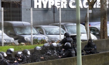 French police take position by a kosher grocery store near Porte de Vincennes in eastern Paris.