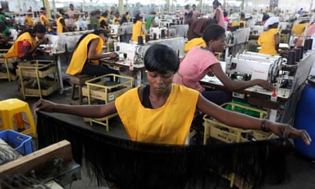 Women at work in a factory in Nigeria's commercial capital, Lagos. Photograph: Akintunde Akinleye/Reuters