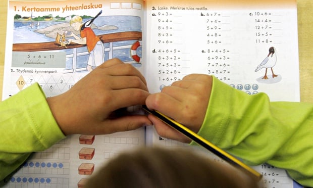 child with Finnish maths text book