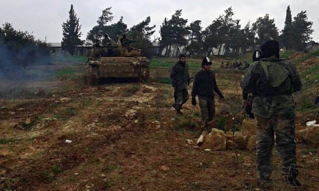 Nusra Front fighters rest after clashes with Syrian troops in Wadi Deif, Idlib province