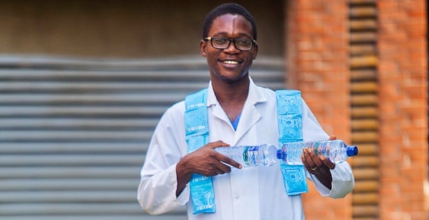Dr Fadipe, one of the Doctors of First Consultant Hospital, who was infected with the Ebola virus and survived, with the Oral Rehydration Solution he  credits for their survival.