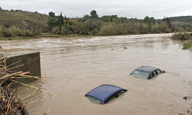 The roofs of flooded cars are seen in the river Berre at Portel les Corbieres, southern France,